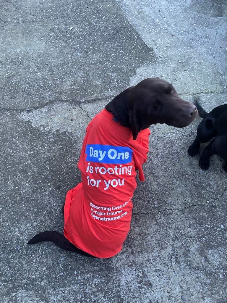 Northern Case Management staff's dog sports a day one trauma top for the 30 miles in march challenge.